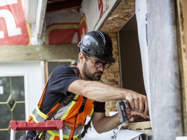 Contractor working on window